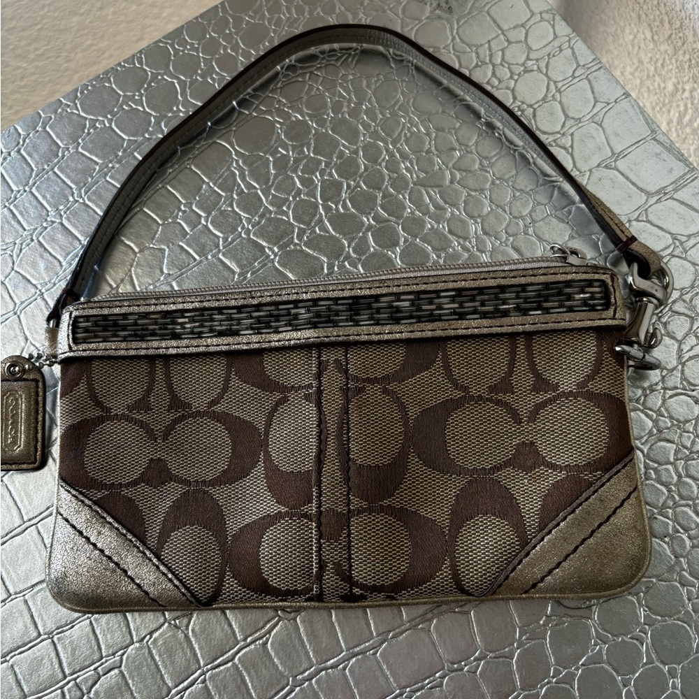 Coach cosmetic bag wristlet detachable handle ,beige fabric lining beaded trim